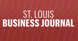 the st. louis business journal logo on a red background